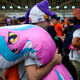 Brony holding My Little Pony body pillow